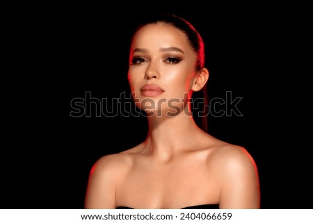 close-up portrait attractive brunette woman isolated on black background, fashionable luxury salon concept for face and body skin care. Gorgeous girl with straight hair. hand near face
