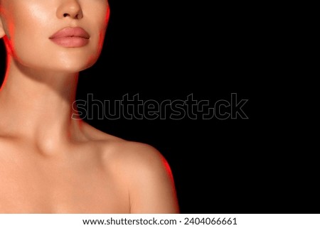 close-up portrait attractive brunette woman isolated on black background, fashionable luxury salon concept for face and body skin care. Gorgeous girl with straight hair. hand near face