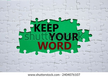 Keep your word symbol. Concept words Keep your word on white puzzle. Beautiful green background. Business and Keep your word concept. Copy space.