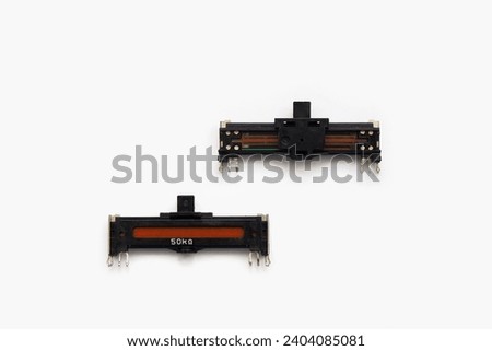 Isolated straight slide potentiometer. Variable resistor.  Royalty-Free Stock Photo #2404085081