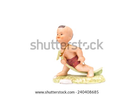 Thai Child ceramic doll with traditional suit while playing game on White Isolate Background