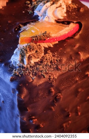 Detail of chocolate cake decorated with oranges. Sweet cake concept background. Selective Focus