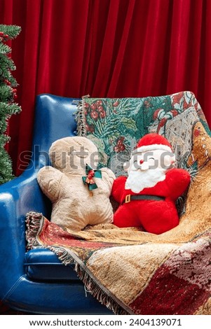 gingerbread man and santa claus at vertical composition