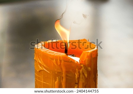 Pictures of burning of big candle in temple with concept religion of people in Thailand country.