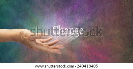 Offering Change - female hand outstretched with the word 'Change' appearing to move outwards indicating change is being suggested, on a multicolored stone effect background and plenty of copy space