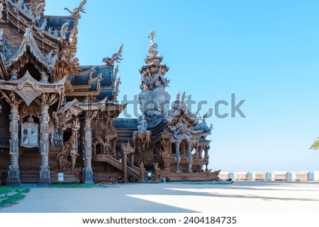 The Sanctuary of Truth wooden temple in Pattaya Thailand, a gigantic wooden temple construction located at the cape of Naklua Pattaya City Chonburi Thailand Royalty-Free Stock Photo #2404184735