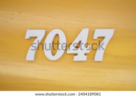The golden yellow painted wood panel for the background, number 7047, is made from white painted wood.