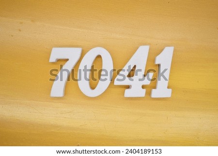 The golden yellow painted wood panel for the background, number 7041, is made from white painted wood.