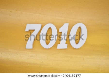 The golden yellow painted wood panel for the background, number 7010, is made from white painted wood.