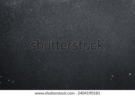 Dark gray textured surface. Free space for text. Concrete background.