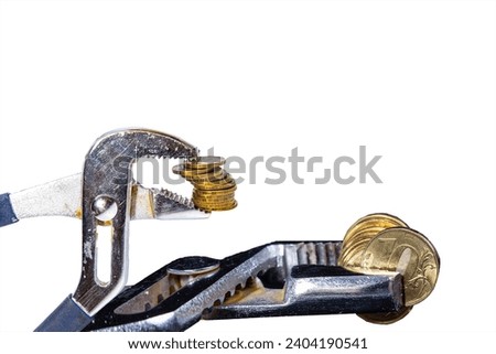 Allegory of the global financial crisis - Iron 10 rubles coin (written ten rubles, the Bank of Russia) in the grip of economic crisis, on a white background. Finance and business concept 