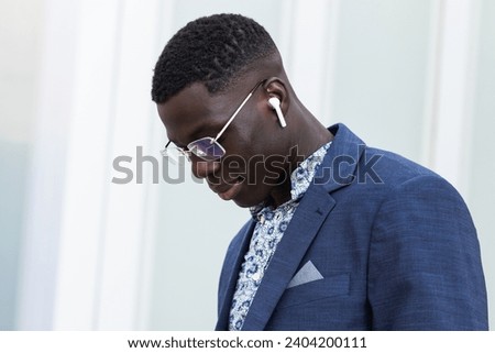 Black business man with headphones outdoor for music podcast. Portrait, accountant and happy ceo listening to radio, audio or hearing sound with smile for jazz, hip hop and song