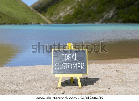 Ideal customer symbol. Concept words Ideal customer on beautiful black chalk blackboard. Chalkboard. Beautiful mountain lake background. Business ideal customer concept. Copy space.