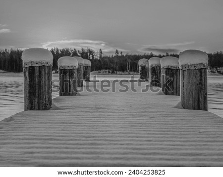 Boat jetty at the lakeside in winter