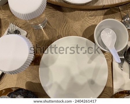 Cutlery set up for formal dining. Empty white plate