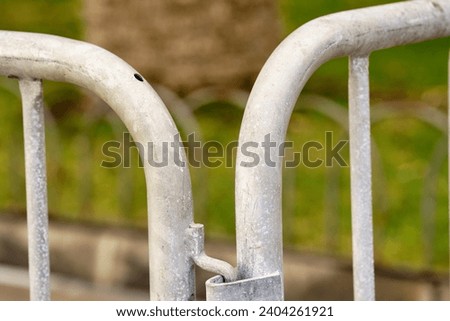 A photo of a do not cross barrier in a park