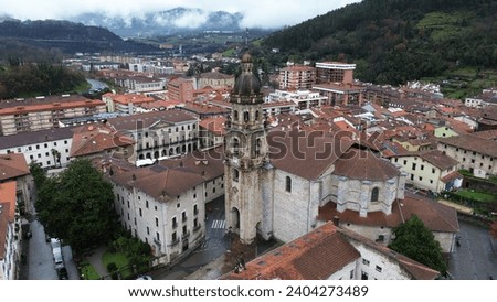 The old part of the town of Bergara with its parish of San Pedro Apostol in the foreground Royalty-Free Stock Photo #2404273489