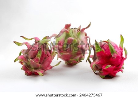 Three pitayas or dragon fruit on a white background