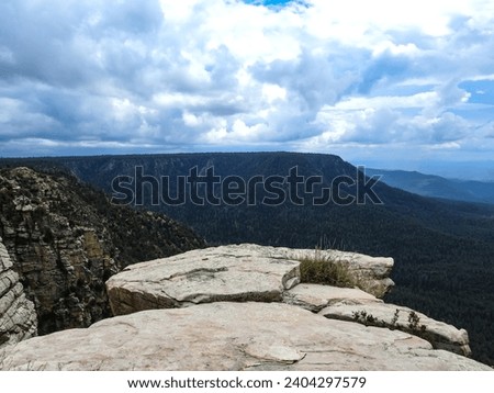 High Atop a Rocky Ledge in the Arizona Mountains on a Cloudy Day Royalty-Free Stock Photo #2404297579