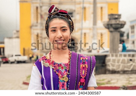 Portrait of beautiful indigenous woman looking at camera. Royalty-Free Stock Photo #2404300587