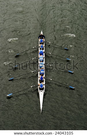 An eight person shell with a coxswain in the middle of a rowing race Royalty-Free Stock Photo #24043105