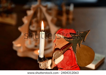 Nikolaus Santa claus figure with candle burning antique. High quality photo