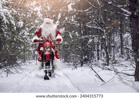 Concept delivery gift for Christmas holiday. Santa Claus in red cloth riding on snow bike, motorcycle with ski background snow forest.