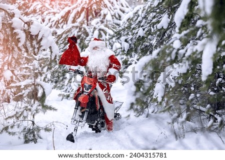 Cool Santa Claus biker or Frost Father riding on fast snow bike, motorcycle with ski background snow forest, sun light. Concept delivering Christmas gifts. Royalty-Free Stock Photo #2404315781