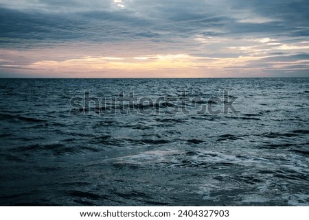 Sunset in Mediterranean sea waves landscape photo. Peaceful seaside time. Beautiful evening scenery photography. Calm waves during vacation.