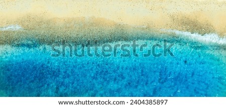 Aerial view of blue sea waves and beach for summer vacation concept. Nature of the beach and sea Summertime with sunshine, sandy beaches, and sparkling waters.