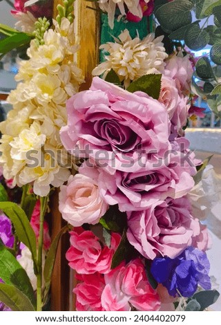 Rose, Lavender, and Dahlia artificial flowers arranged as a decorative piece
