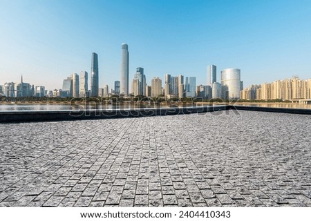 empty square with city skyline in guangzhou china