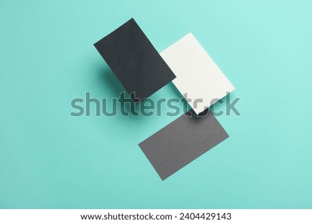 Composition of floating business cards on a blue background. Business concept