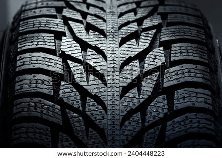 new car tire background. close up of texture. Stack of brand new high performance car tires on clean high-key white studio background Royalty-Free Stock Photo #2404448223