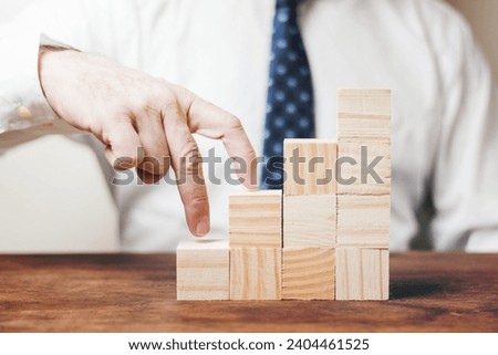 businessman using wooden pieces. Resolution and high quality beautiful photo