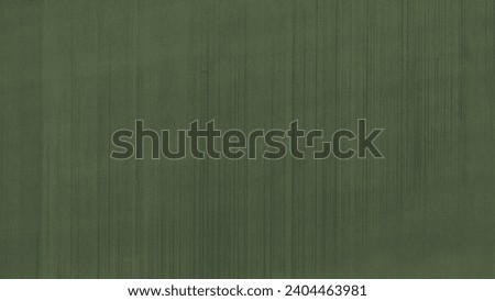 Perpendicular aerial view of a green grass field for architectural landscape design texture