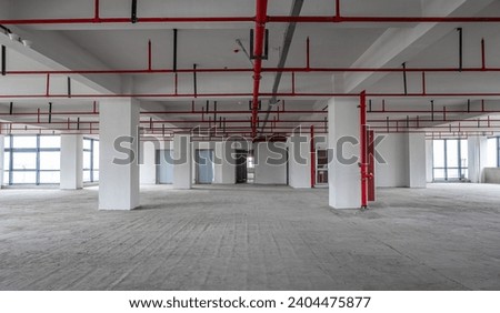 Empty business building building interior, ready for sale renovation, exposed cement