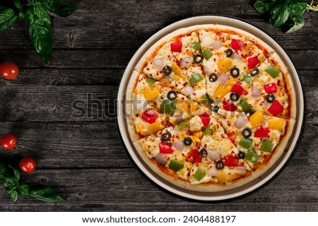 Veg pizza or vegetable pizza on a table top view. veg cheese pizza Royalty-Free Stock Photo #2404488197