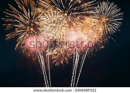 Amazing festive fireworks on the night sky. Merry Christmas and Happy New Year card. Celebration