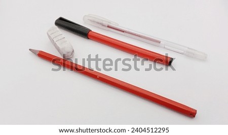An LED pencil, also known as a mechanical pencil, is a writing instrument that utilizes thin graphite.A razor is a grooming tool used for raze .A marker is a writing or drawing instrument. Royalty-Free Stock Photo #2404512295