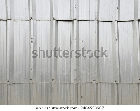 Vintage style metal sheet roof texture.Pattern of old metal sheet.Rusting metal or siding. Corrosion of galvanized.Background and texture in retro concept