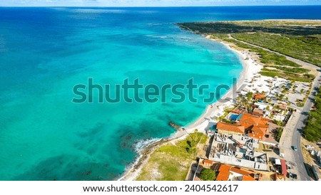 Arashi Beach, Beautiful beach with turquoise blue sea, sunny morning. Calm and peaceful beach, great for snorkeling. Drone photo Top View