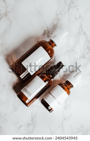 Minimalist Beauty and Skincare Bottles on Marble Surface