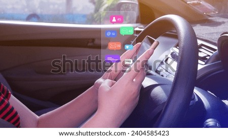 Woman using social media and digital online marketing concepts on mobile phones with icons such as notifications, messages, comments on the smartphone screen in a car.