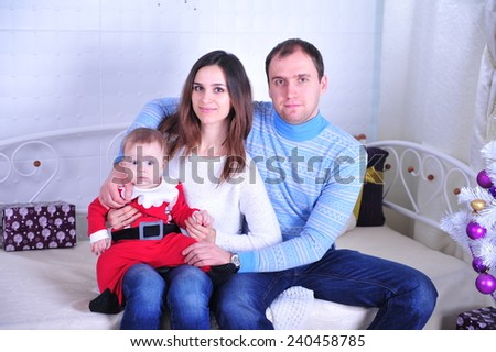 Family sitting together in Christmas interior. Happy family having fun with Christmas presents. Christmas Family Portrait, Mother And Son Celebrate Holiday, Opening Present Gift Box 