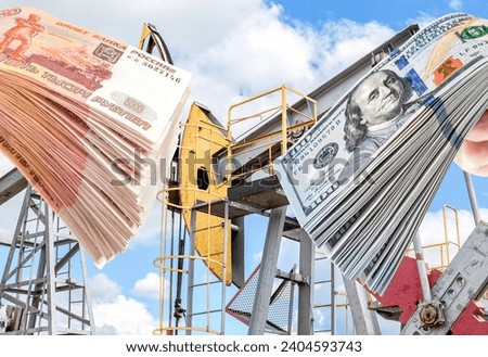 American dollars and russian rubles in the hands against the oil pump jack extraction machine. Buying and selling oil for dollars. Oil industry equipment and finance