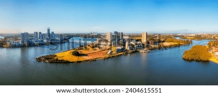 Modern suburb of Rhodes on waterfront of Parramatta river in Sydney west - skyline aerial cityscape panorama. Royalty-Free Stock Photo #2404615551