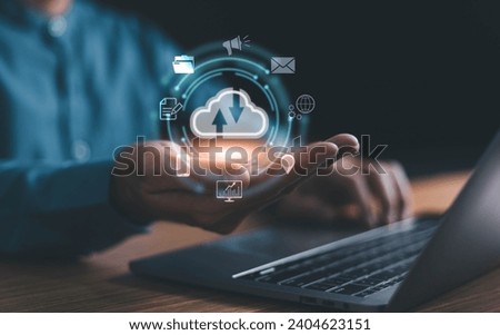 Man use Laptop with cloud computing diagram show on hand. Cloud technology. Data storage. Networking and internet service concept. Cloud Computer technology and storage online for business network.

