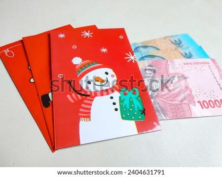 Envelope christmas theme and Indonesian money or rupiah. Christmas gift concept