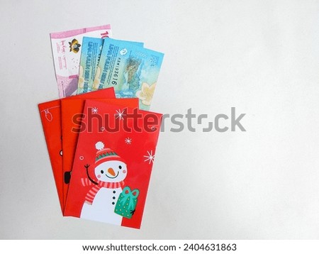 Envelope christmas theme and Indonesian money or rupiah. Christmas gift concept
